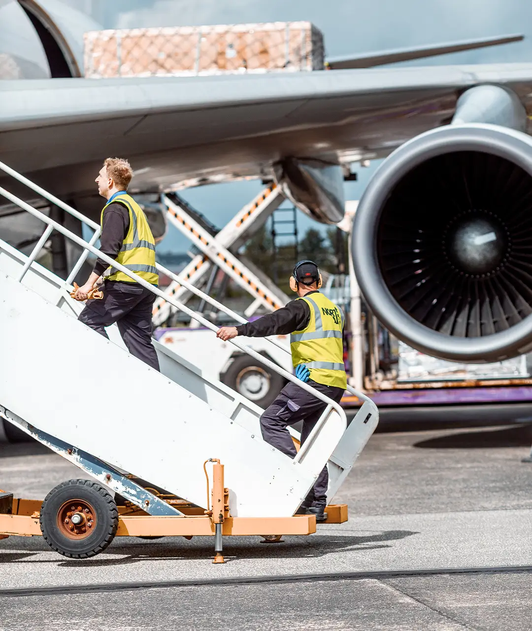 two-ground-crew-heding-up-steps-into-cargolux-aircraft-1